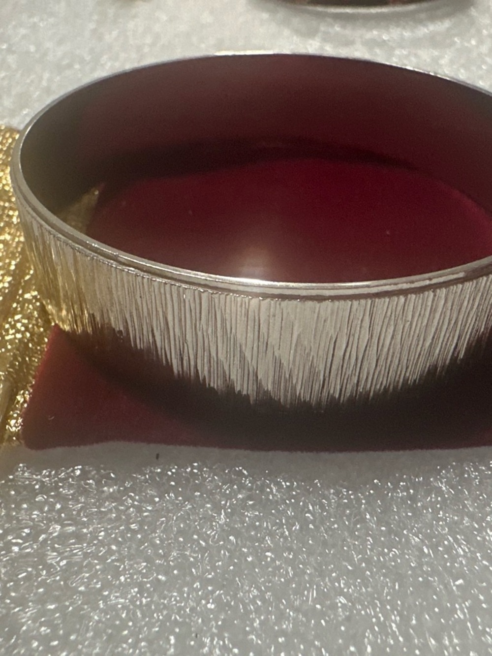 Napier Silver-Tone Textured Bangle Bracelet with Burgundy Interior
